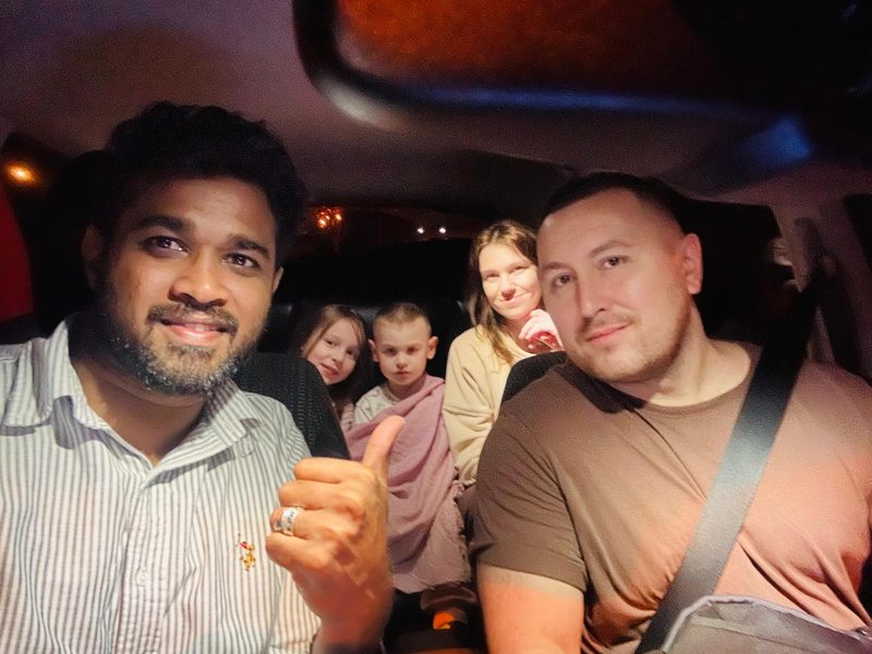 A family with V68 Adventures private driver during an evening transfer in Sri Lanka